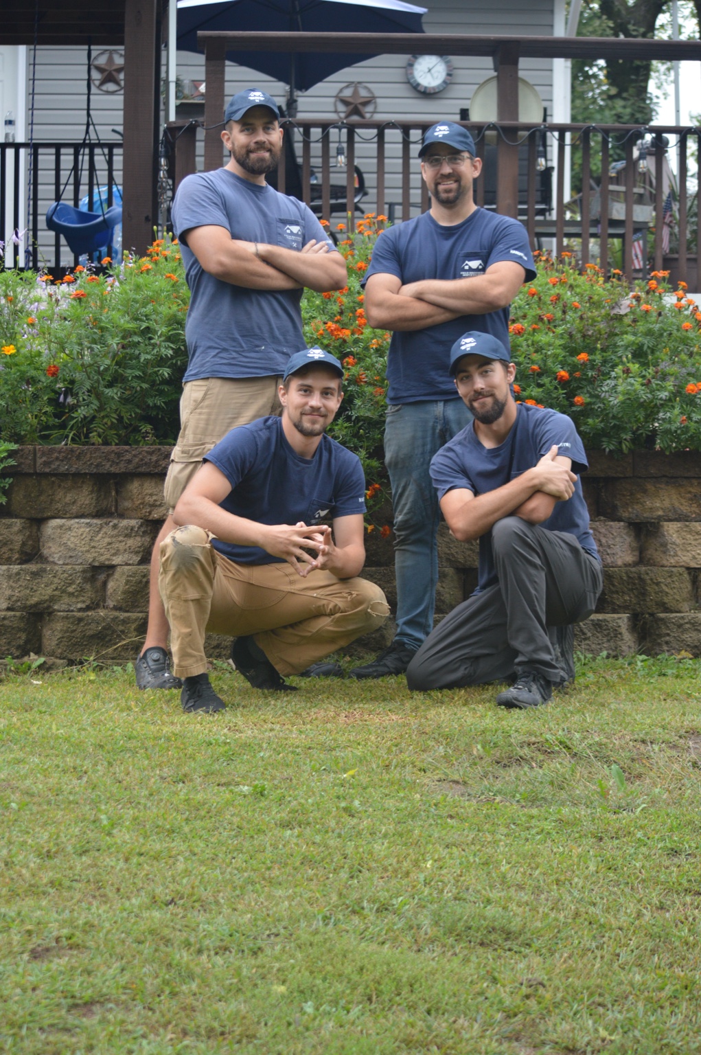 The Field Brothers team together outside a Twin Cities home